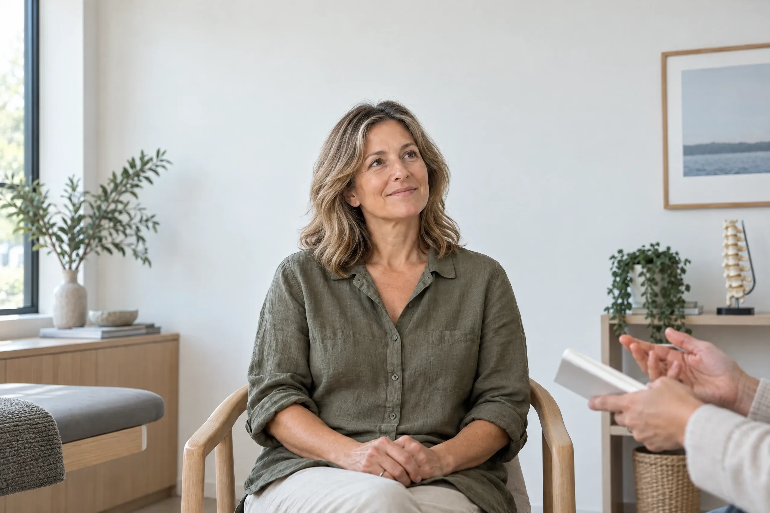Adult sitting comfortably and fully clothed before a pelvic floor evaluation at a Camarillo, California clinic